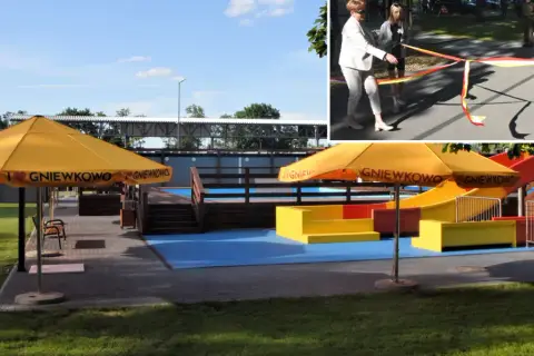 Uroczyste otwarcie placu zabaw w Gniewkowie. Żółte parasole z napisem "Kocham Gniewkowo" i kolorowe zjeżdżalnie zapraszają do zabawy.