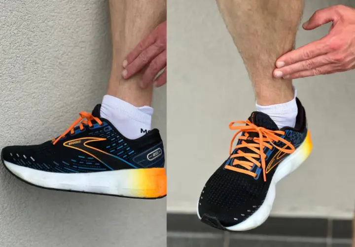 Biegacz pokazuje ból w łydce, który może być objawem shin splints. Na nogach ma czarne buty sportowe Brooks z pomarańczowymi sznurówkami.