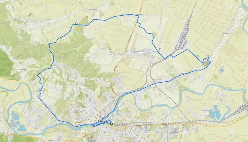 Mapa z zaznaczonymi roztocze trasy rowerowe, prowadzące przez tereny zielone i w pobliżu rzeki.