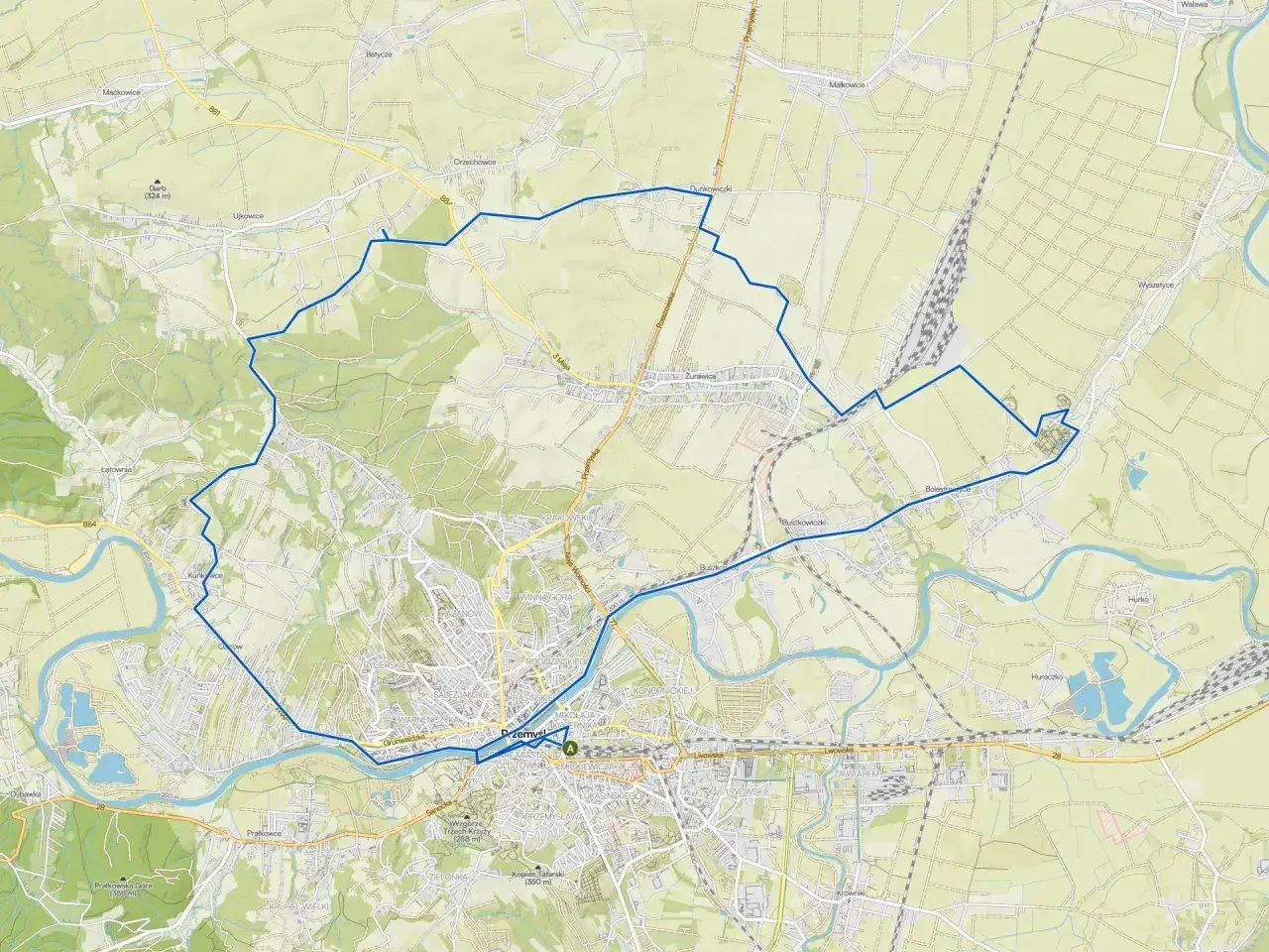 Mapa z zaznaczonymi roztocze trasy rowerowe, prowadzące przez tereny zielone i w pobliżu rzeki.
